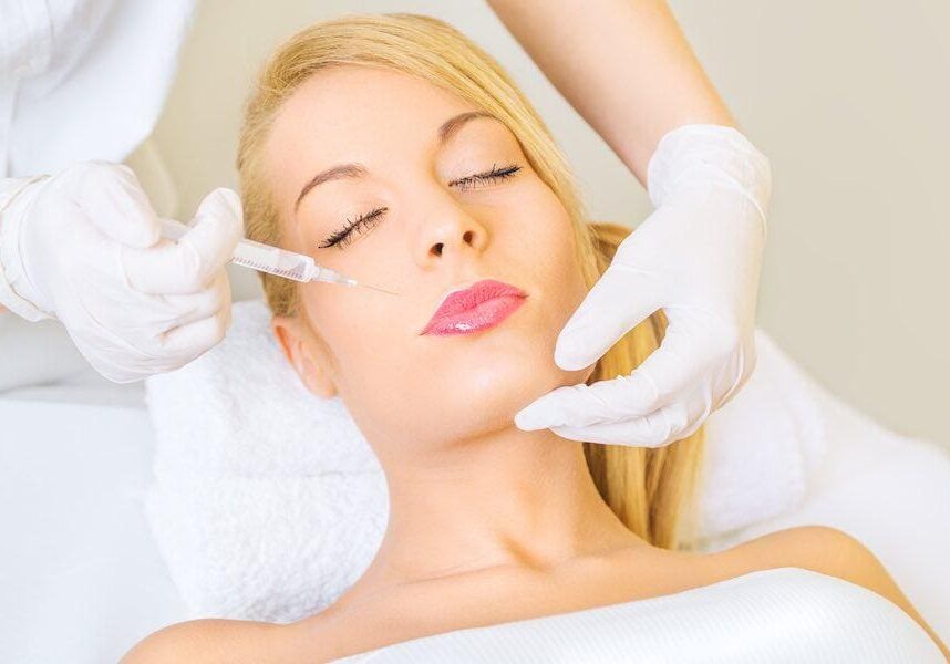 Woman receiving a cosmetic facial injection.