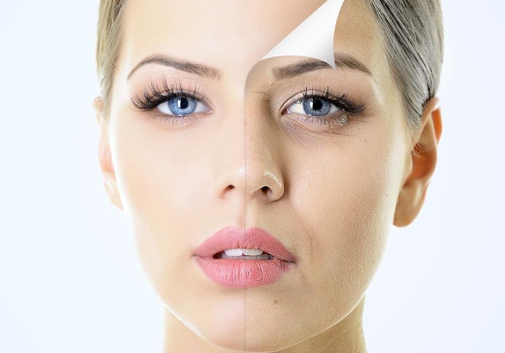 Close-up of a woman's face with a transparent protective film peeling off her skin.