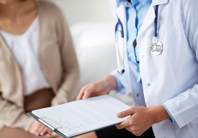 Doctor consulting a patient with a medical chart.