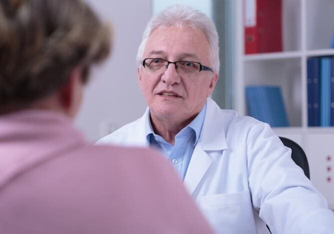 Doctor consulting with a patient in a medical office.